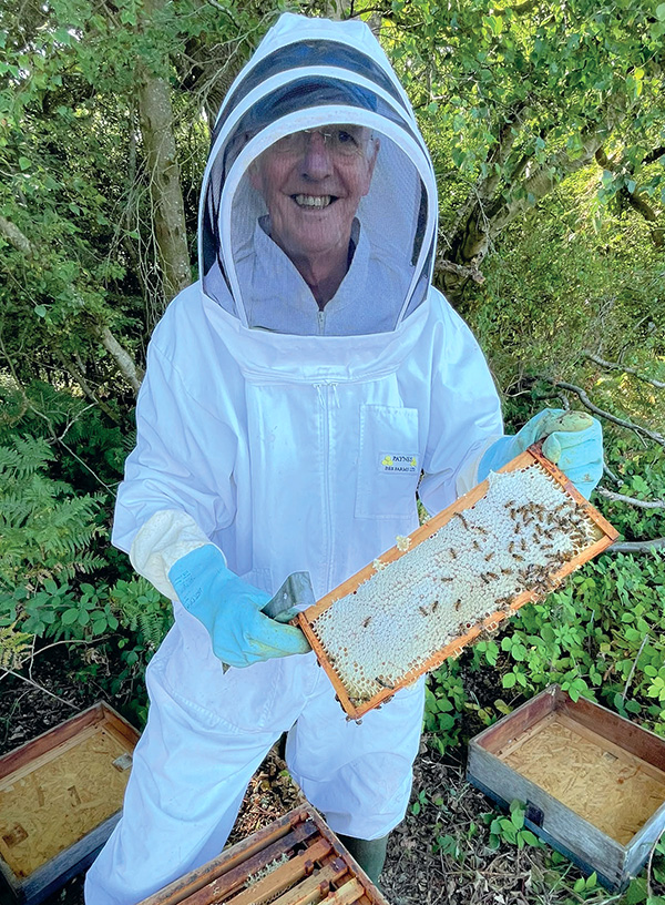 michael holding honey frame